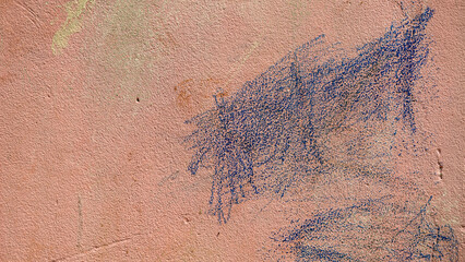 Pink wall with blue paint splatter abstract texture