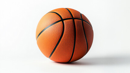 Fototapeta premium An orange basketball with black lines is sitting on a white surface in a studio environment