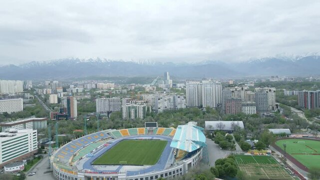 Almaty Central Stadium with City Roads, Cars, Mountains, Kok Tobe, and Esentai Mall