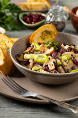 Spring salad with red beans and mushrooms. Served with croutons and garlic butter.