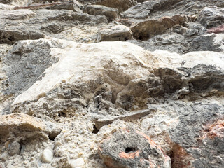 Rugged stone texture with natural erosion patterns in close-up view