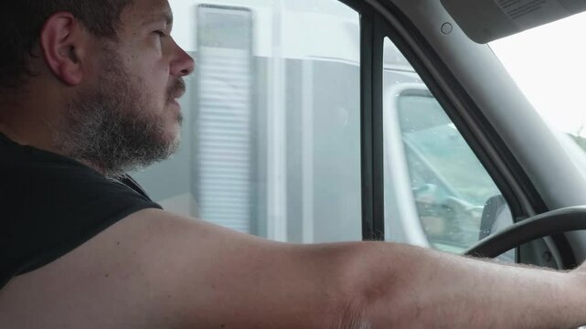 A fatigued truck driver struggles to stay awake before dangerously nodding off while driving, putting himself and others at great risk.