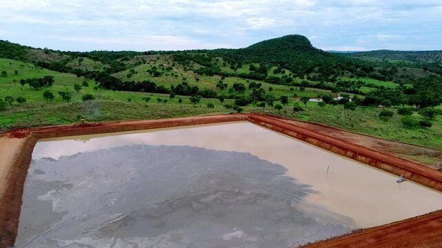 Mining operational structure, man-made containment area, tailings pond