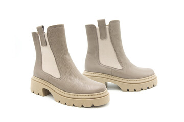 Fashionable leather boots with heels isolated on white background. View from all sides.	