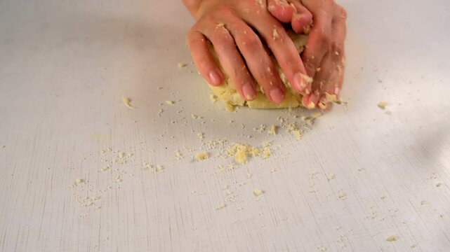 Woman hands kneading shortbread dough cooking pie or cookies on kitchen at home. Recipe cuisine culinary ingredient. Baking, preparing dessert, homemade fresh meal. Make cook fresh meal, pastry.