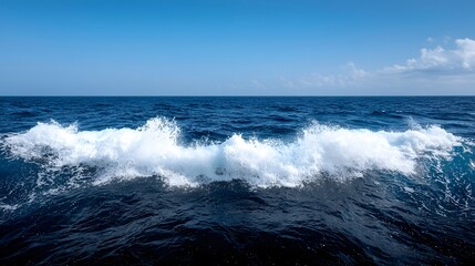 Fototapeta premium Detailed view of dynamic ocean waves forming mesmerizing ripples foam and fluid patterns in deep shades of blue and white showcasing the natural beauty and design of the sea