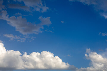 Cumulus and stratocumulus clouds in a blue sky