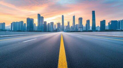 Fototapeta premium Empty Highway Leading to Modern City Skyline at Sunrise