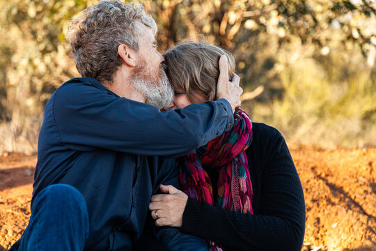 Husband kissing wife