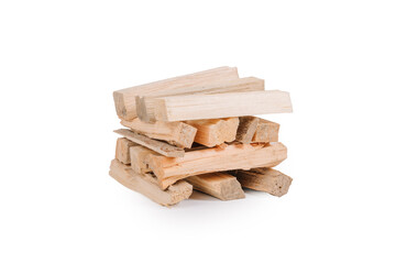 Stack of light-colored firewood pieces neatly arranged on a white background, ideal for fireplace, stove, or campfire use. Isolated with copy space..