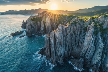 Stunning sunset over rugged cliffs with ocean waves crashing below, showcasing nature's beauty