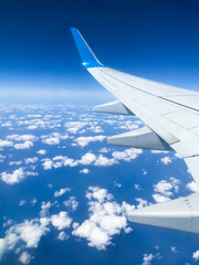 Obraz premium sky airplane clouds wing flight
