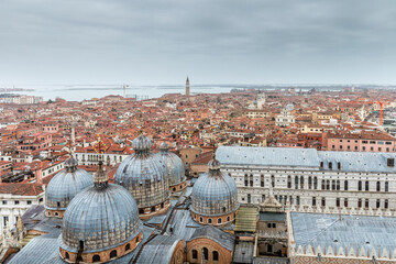 Venice, Italy - February 10, 2024: Aerial view of St. Mark's Basilica and Doge's Palace in Venice from campanile, Italy