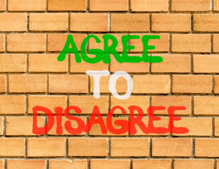Agree to disagree symbol. Concept words Agree to disagree on beautiful brick wall . Beautiful brick...