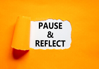 Pause and reflect symbol. Concept words Pause and reflect on beautiful white paper. Beautiful orange paper background. Business motivational lifestyle pause and reflect concept. Copy space.