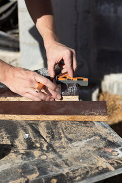 Hands of man measuring DIY project