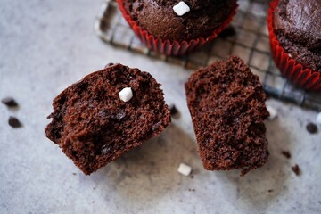 Homemade hot chocolate muffins with mini marshmallows, selective focus