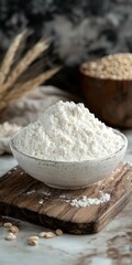 Fototapeta premium Mound Of White Flour On A White Bowl, With Wheat Seeds Background On Breadboard Close Up Still Life