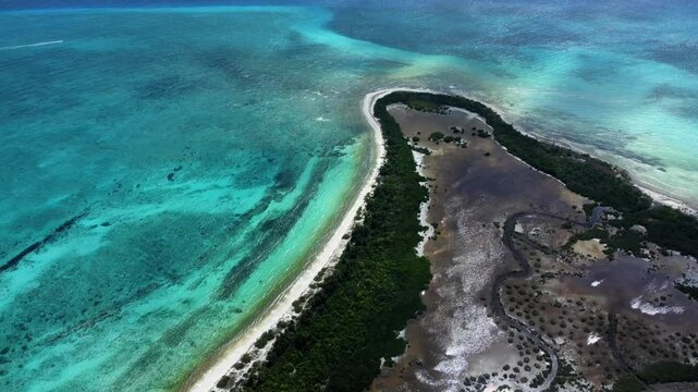 A video starting with an aerial view of Punta Sur, Cozumel, Mexico, then turning left to reveal the vast open ocean and the continuation of the scenic coastline.