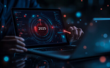 Fototapeta premium Businessman using laptop and tablet with a target icon, a graph of growth in business during the year on a virtual screen for a business plan