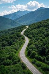 a view of a winding road in the mountains with trees and bushes