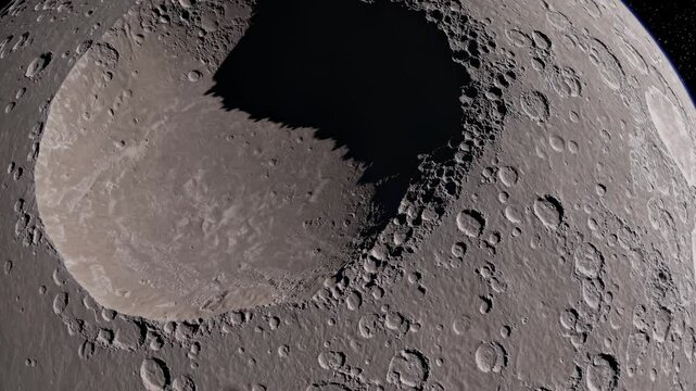 Aerial video view of a moon's cratered surface, showcasing rugged terrain and shadows. Captured from a high-angle perspective in grayscale. Live desktop wallpaper.