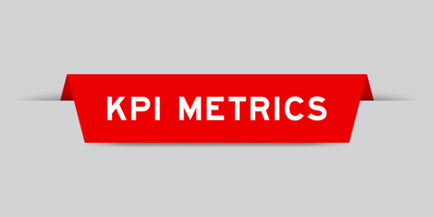 Red color inserted label with word KPI (Abbreviation of key performance indicator) metrics on gray background