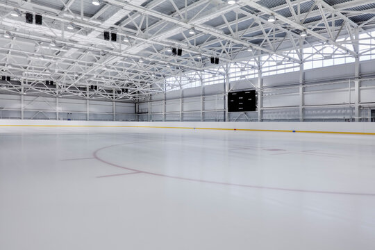 Interior view of an ice rink with ice hockey markings.