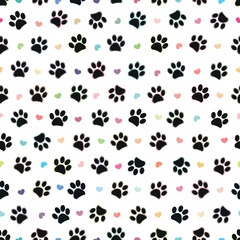 Colorful shining black paw prints seamless pattern