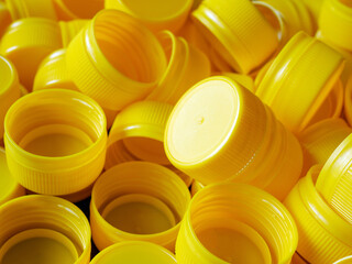 yellow plastic bottle caps.Recycling collection and production processing plastic bottle caps...