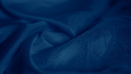 Elegant blue silk fabric draped gracefully with a soft iridescent shine.