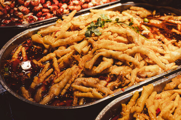 Chinese street food, spicy chicken feet