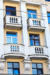This is a building that features numerous windows and multiple balconies
