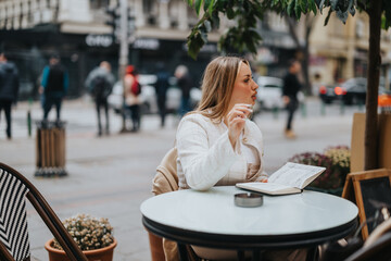 A professionally dressed woman sits at an outdoor cafe table with a notebook, talking.
