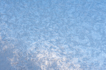 Full-frame background with an ice-frozen glass, extreme close-up