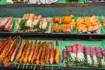 assortment of traditional Vietnamese street food on the counter at the Asian Night Market in...