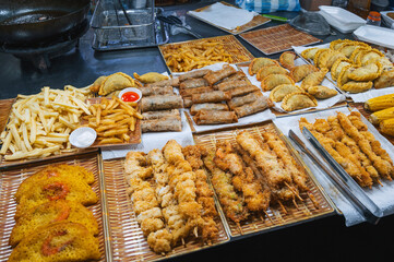 Traditional Vietnamese food and pastry on counter at the Asian night market on street in Vietnam in Asia in Da Nang