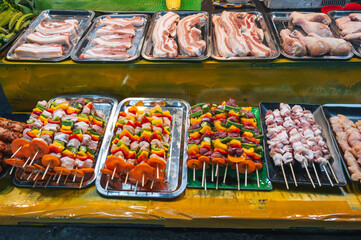traditional Vietnamese food and meat barbecue at the Asian night market on the street in Vietnam in...