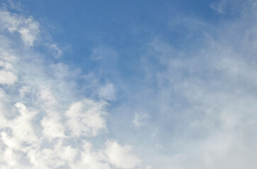  Blue sky with white light airy clouds background . Horizontal sky landscape.