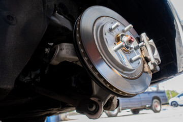 An electric vehicle inspection involves checking brake pads and disc brakes for malfunctions, ensuring safe and efficient vehicle operation