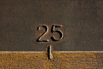 A mark, the number 25 on the metal hull of the Walla Walla Ferry, between Seattle and Bremerton