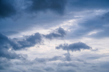 Twilight, sunset sky, clouds in the evening at dusk with blue light.
