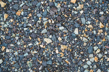 Crushed dark grey gravel stone texture horizontal