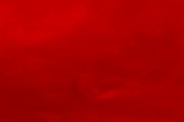 Red cloud texture background. Blurred photo of red sky with clouds. Photo can be used for galaxy space, New Year, Christmas and all celebrations backgrounds.