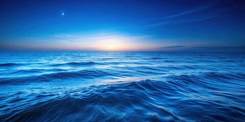 Obraz premium Serene Waters Meet the Horizon Under a Sky Painted with Hues of Twilight and a Crescent Moon