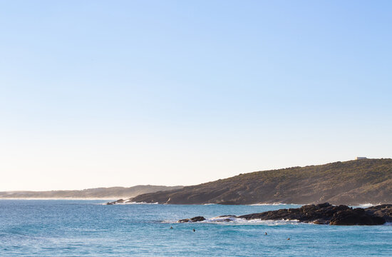 looking across Native Dog to Dillon Bay with distant surfers