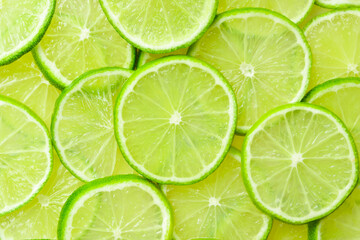 Lime pattern. Top view citrus green fruit. Close up.