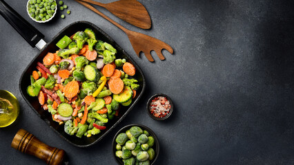 Mixed frozen vegetables in a pan, ready to cook. Close-up. Organic frozen vegetables.