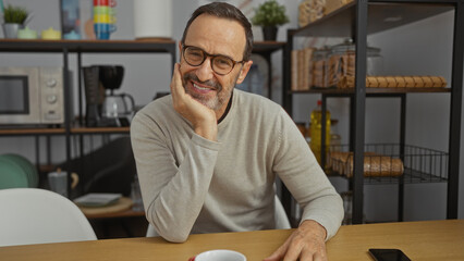 Middle-aged man smiling confidently in an office setting, showcasing a mature and handsome...