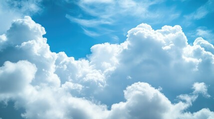 Obraz premium Blue sky with fluffy white clouds, peaceful and uplifting